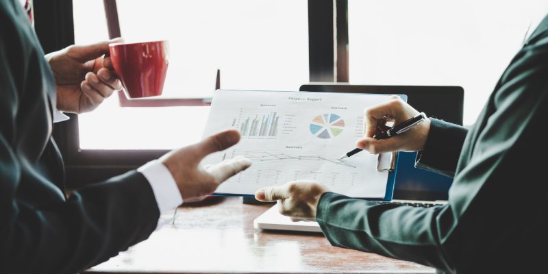 No measurable business impact - executives reviewing a finance report